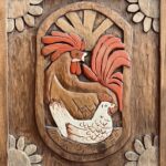 hand carved 9.25 x 11 wood carving hangings of chickens - some parts painted. On back: Made by Rosalie A. Trudell March 1985 Cumberland Wic