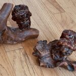 (2) apple sculptures by Viola on wood base